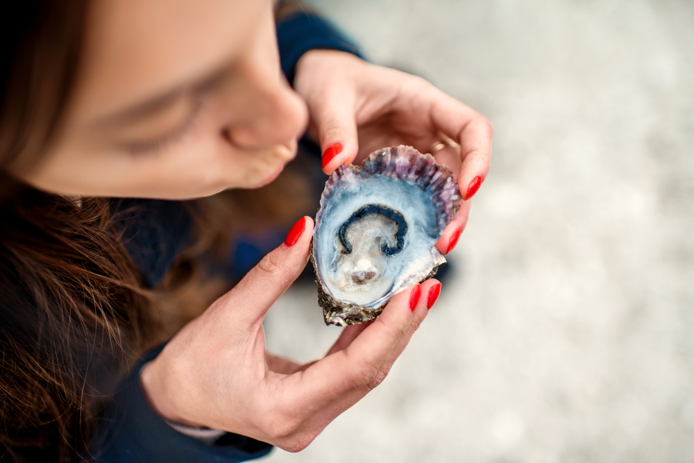 girl eating oyster