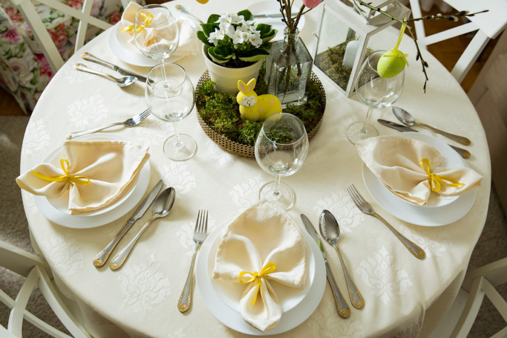 Easter Dining Table with Moss decorations. Image by Aleksandra Suzi via Shutterstock