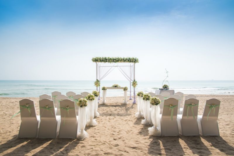 Romantic Wedding setting on the beach. Image by Satit Sewtiw via Shutterstock.