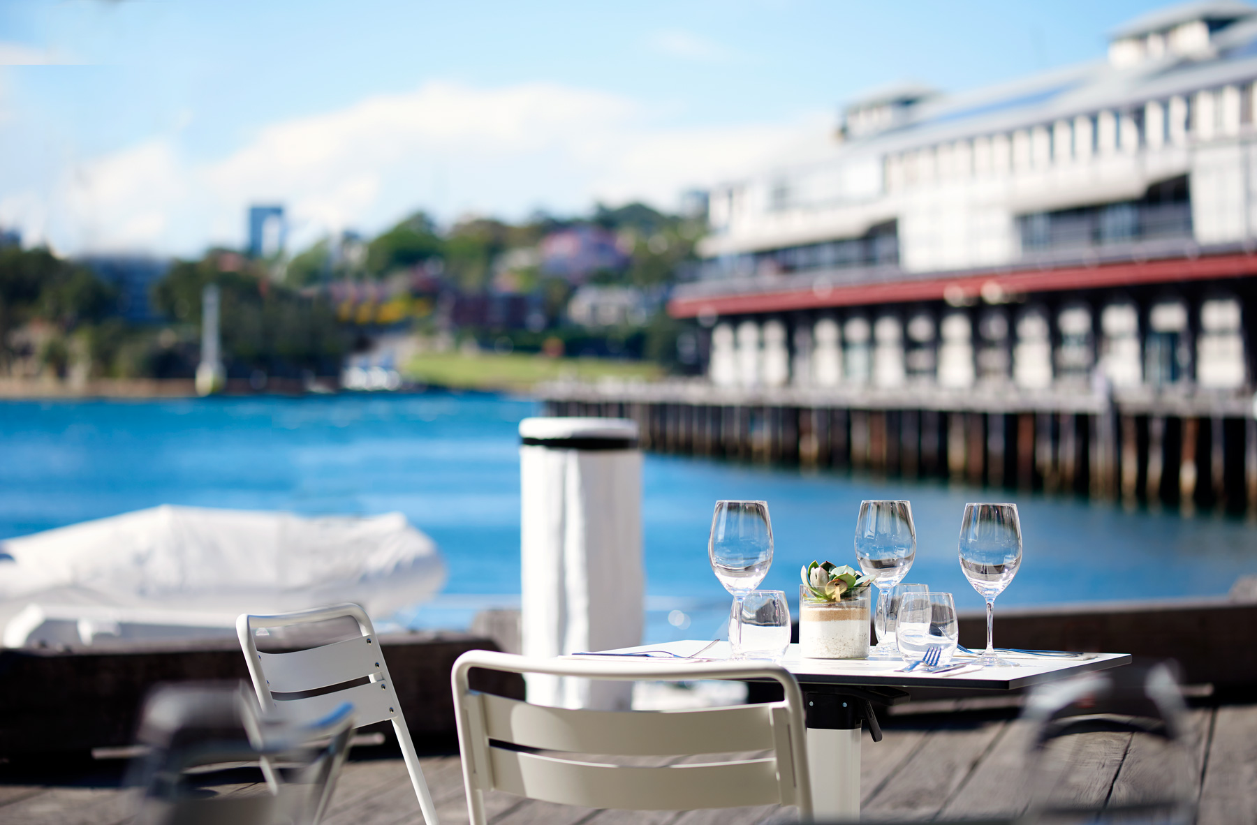 Outdoor setting with Walsh Bay in the background. Image: Supplied