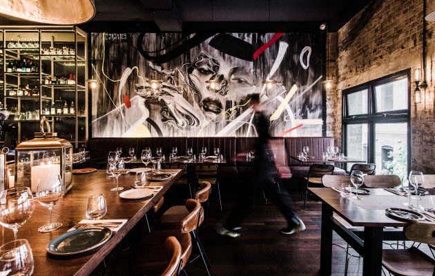 Waiter walks through dining room at Eastside Kitchen and Bar. Image: Supplied