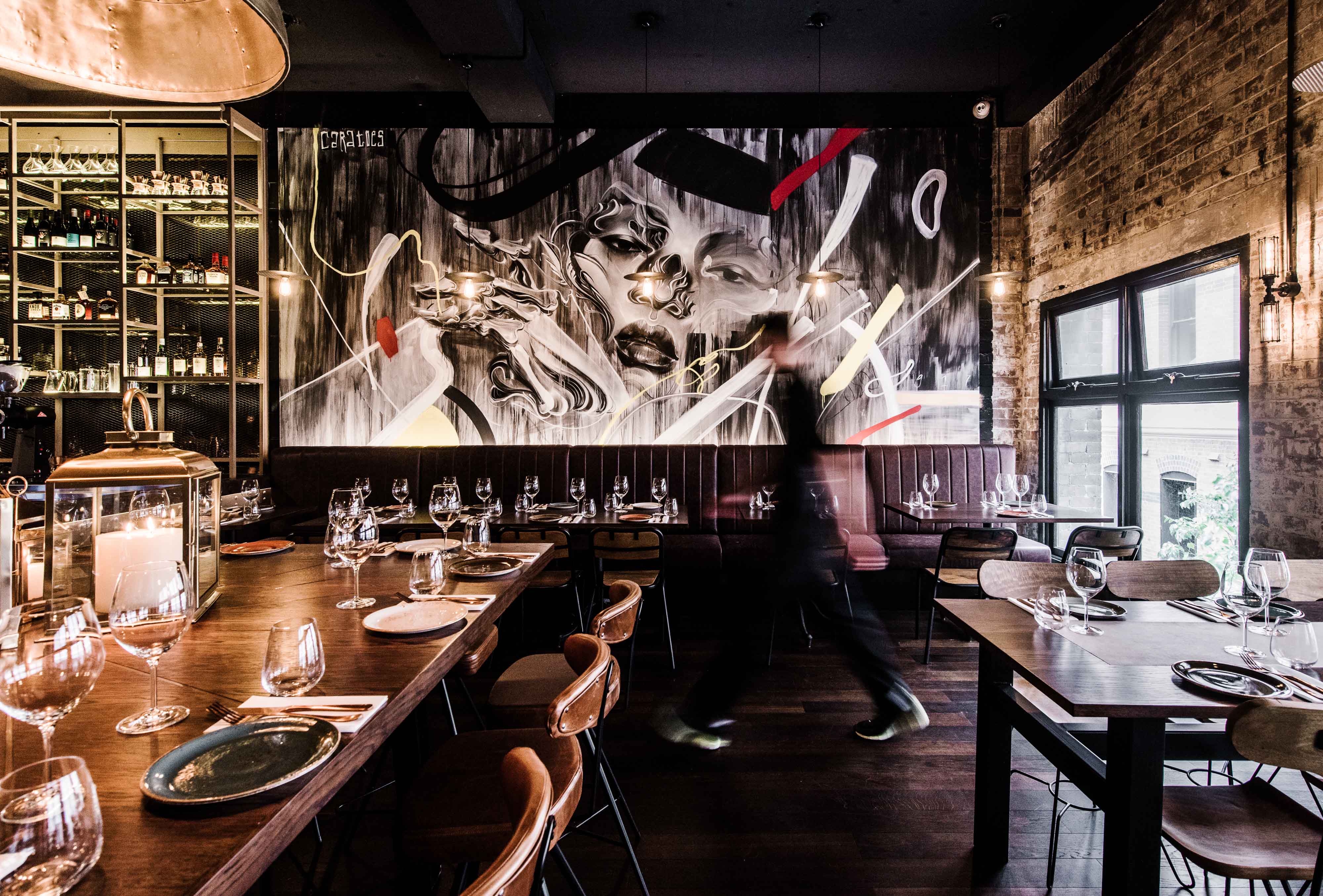 Waiter walks through dining room at Eastside Kitchen and Bar. Image: Supplied