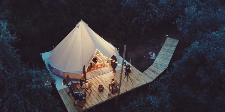 Glamping tent. Photographed by Moise Sebastian. Image via Shutterstock