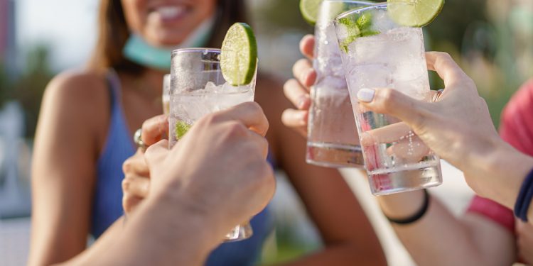 Friends cheers cocktails. Image by Giuseppe Lombardo via Shutterstock.