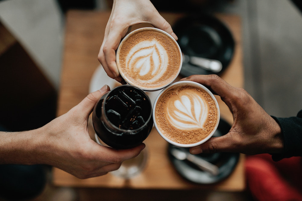 Coffees at cafe. Image by Natahn Dumlao via Unsplash.