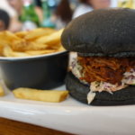 Pulled Pork Charcoal Roll. Sisterfields, Seminyak, Bali. Photographed by Rebecca Magro. Image supplied via Hunter and Bligh.