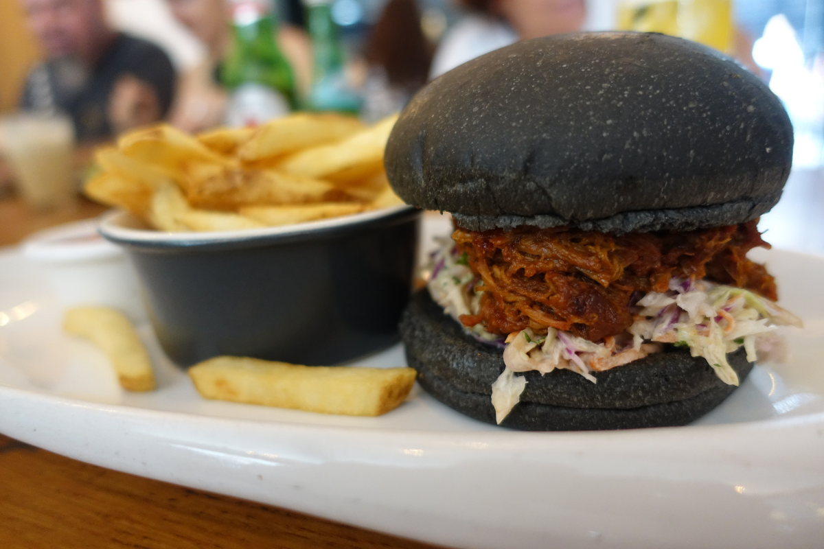 Pulled Pork Charcoal Roll. Sisterfields, Seminyak, Bali. Photographed by Rebecca Magro. Image supplied via Hunter and Bligh.