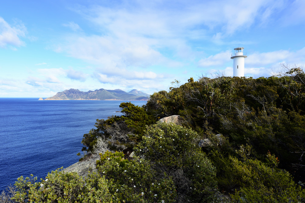 Cape Tourville Lighthouse on the Freycinet Peninsula near Coles Bay, Tasmania, Australia. Image by Eric M Williams via Shutterstock