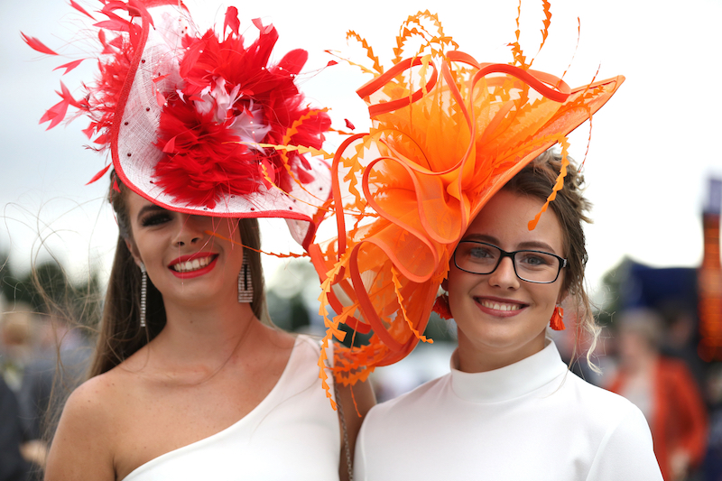 Women in large hats. Image by Mick Atkins via Shutterstock.