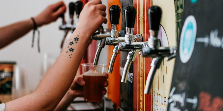Beer Taps. Image by Adam Wilson via Unsplash.