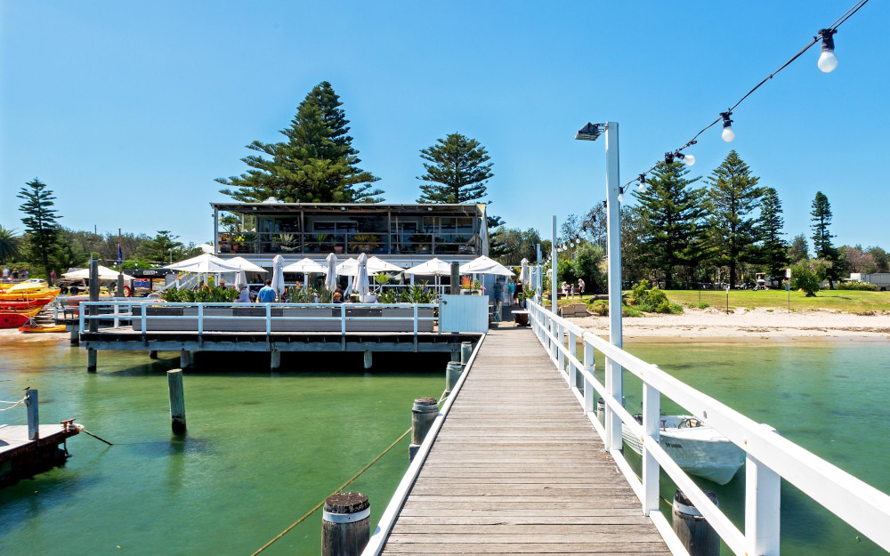 Jetty leading to The Boathouse Palm Beach, Sydney. Image: Destination NSW