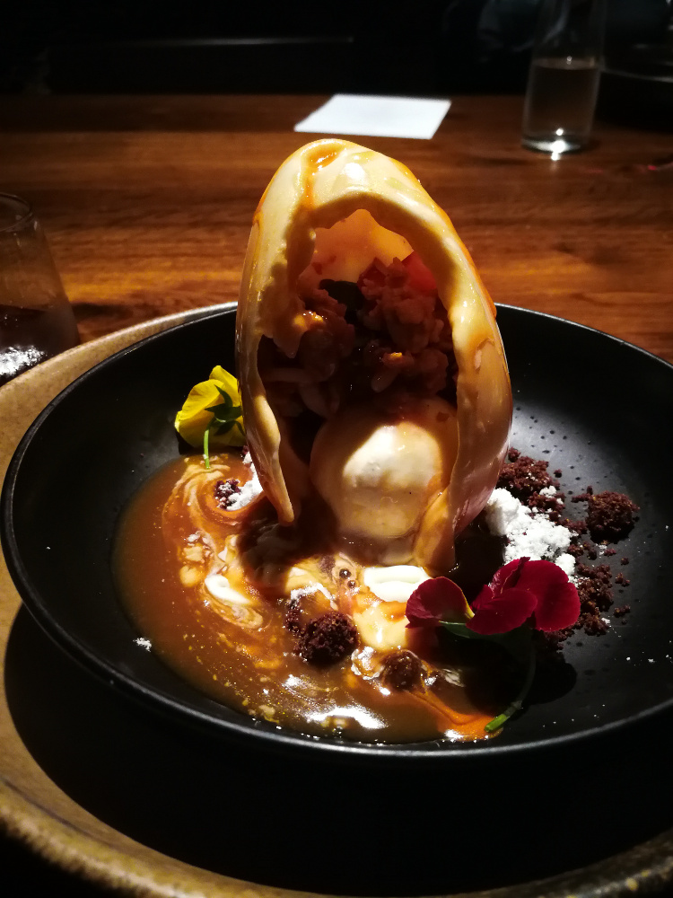 Dragon egg / with passionfruit, nut crumble and miso caramel. Image: Christopher Kelly