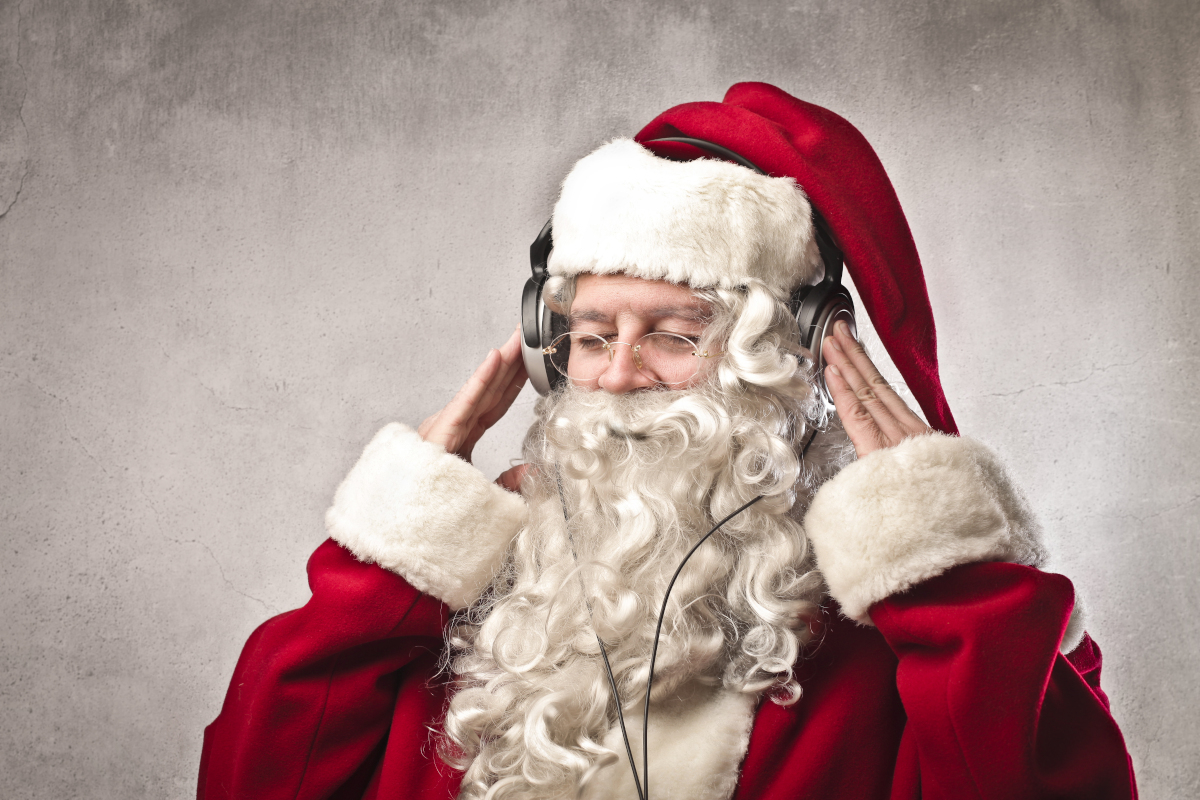 Santa Claus listening to msuic. Image: Ollyy / Shutterstock