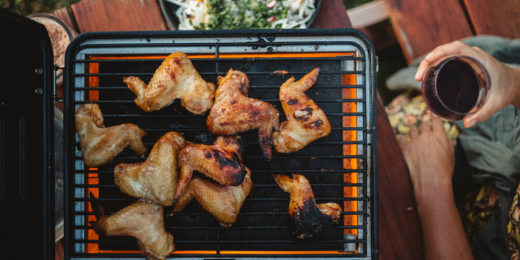 Grilled Whisky Chicken Wings from WILD: Adventure Cookbook by Sarah Glover. Image supplied