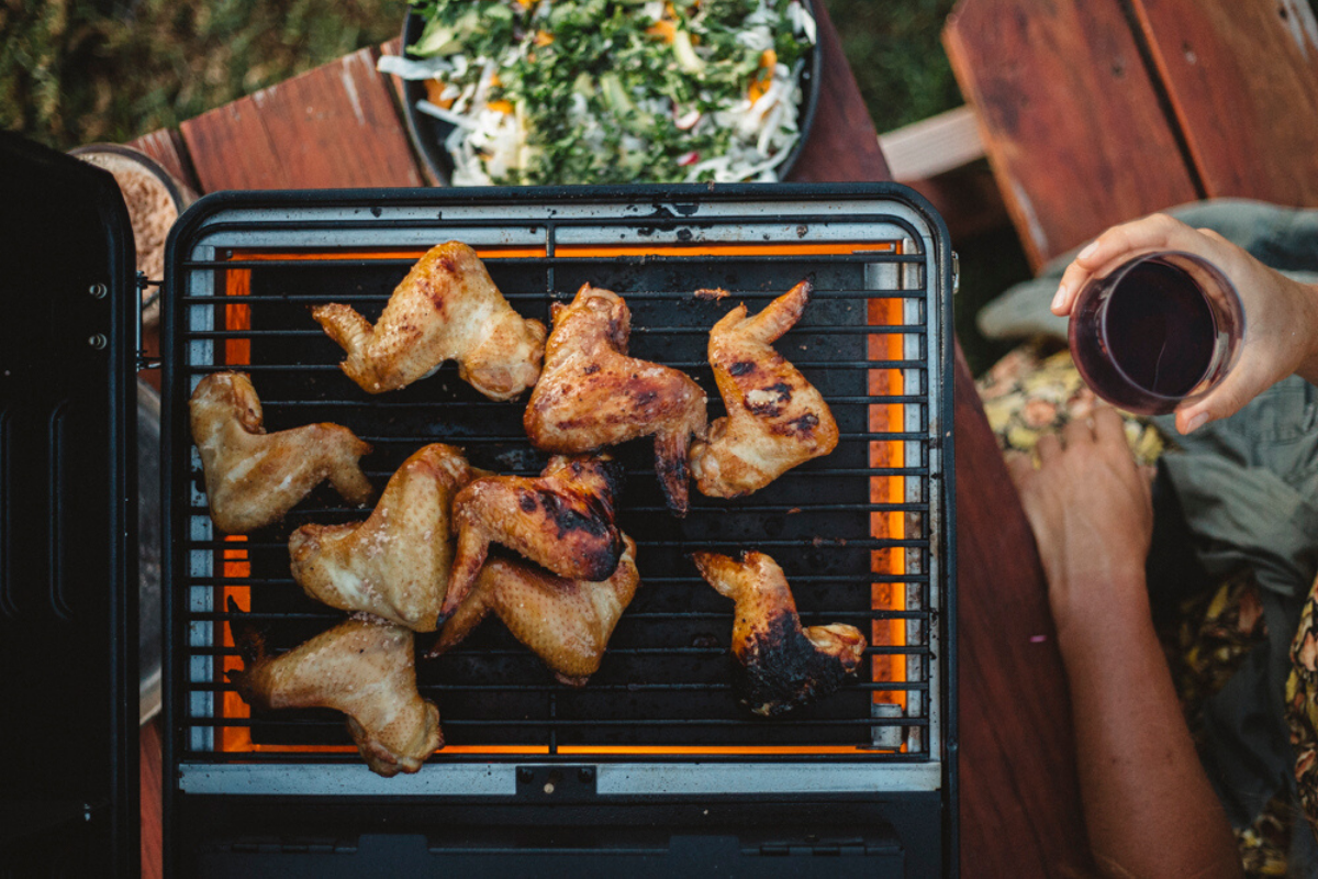 Grilled Whisky Chicken Wings from WILD: Adventure Cookbook by Sarah Glover. Image supplied