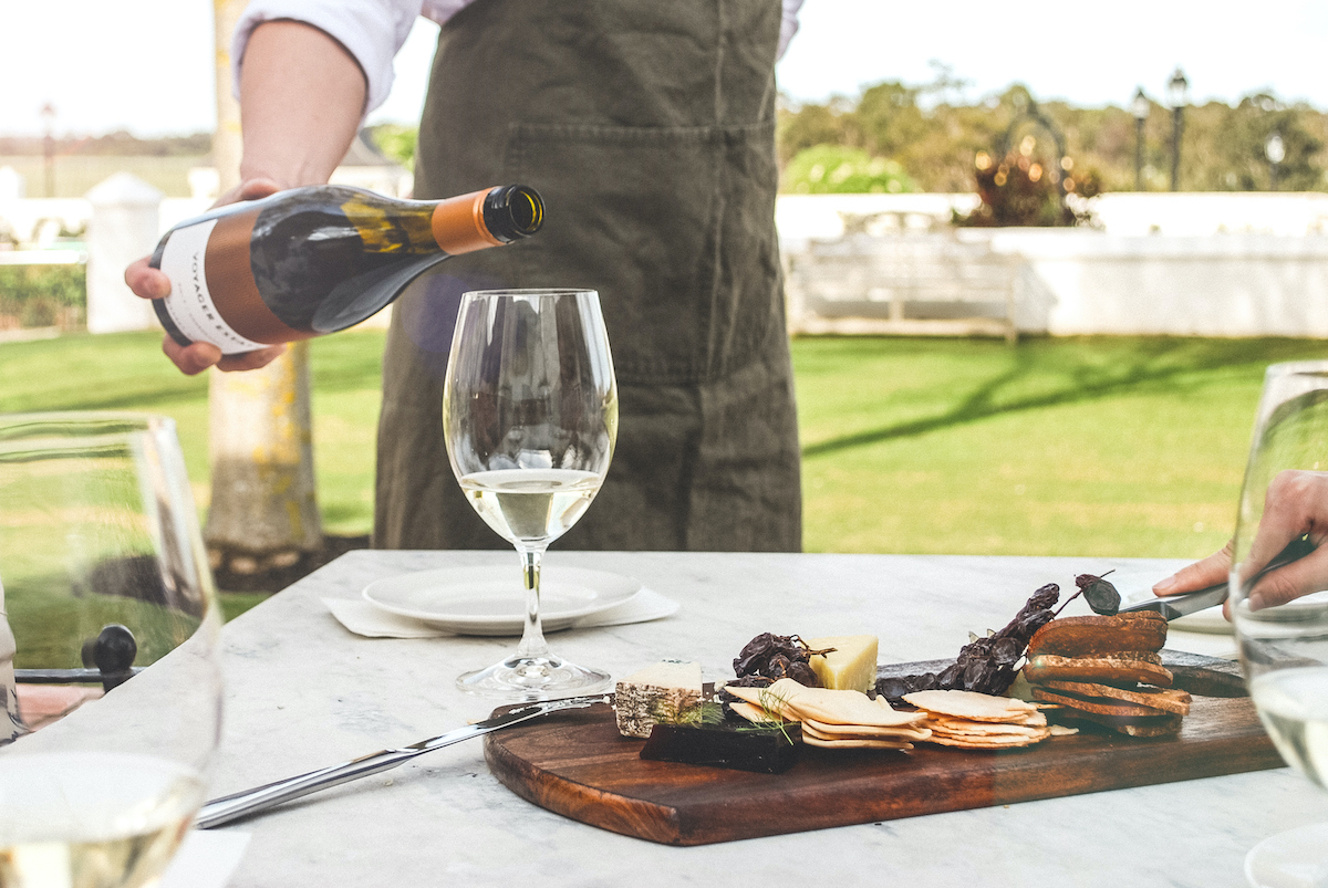 A glass of wine accompanied by a cheese board at Voyager Estate. Photographer: GAV. Image supplied.