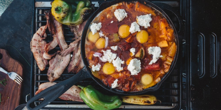 Sarah Glover WILD_ Adventure Cookbook. Heirloom Tomato Shakshuka with Bacon Salsa. Image supplied