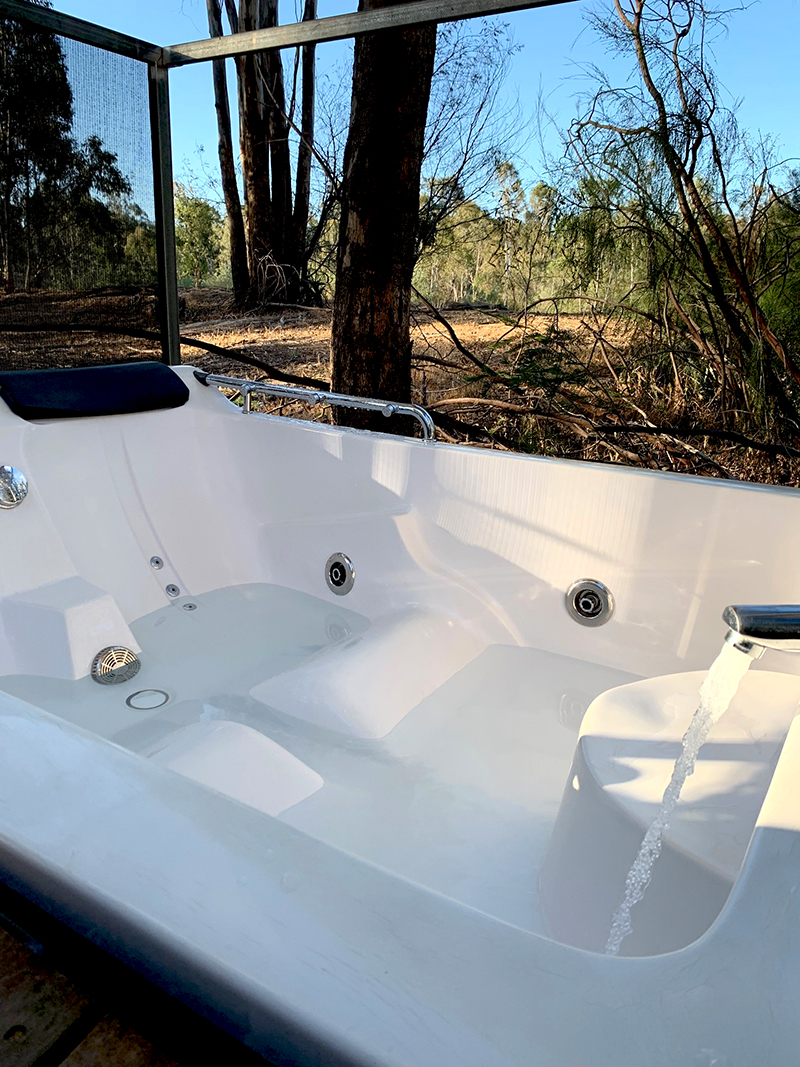 Outdoor spa bath -Talo Retreat. Moama on The Murray Resort. Image via Rebecca Cherote for Hunter and Bligh