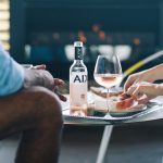 Drinks on the outdoor terrace with golden fireplace in background. Image: Supplied