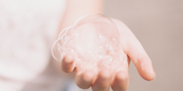 Hand bubbles. Photographed by Matthew Tkocz. Image via Unsplash