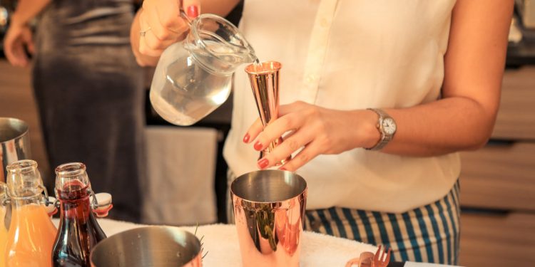 Cocktail making at home. Photographed by Athena Nadi. Image via Shutterstock