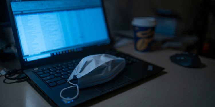 Face mask on laptop. Image: Dimitri Karastelev on Unsplash