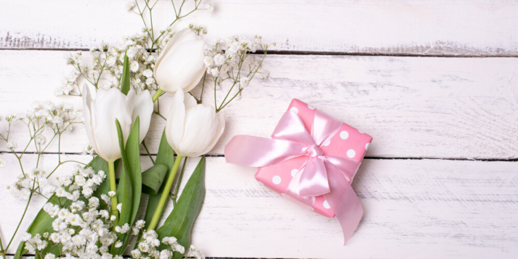 Flowers and present. Photographed by ovchinnikova_ksenya. Image via shutterstock