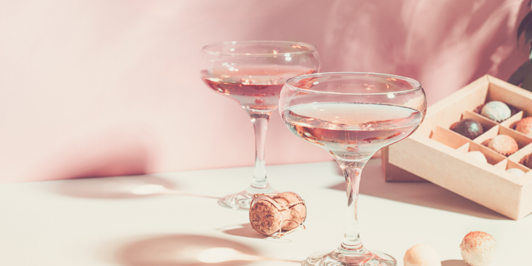 Wine and box of chocolates. Photographed by Natali Ximich. Image via Shutterstock