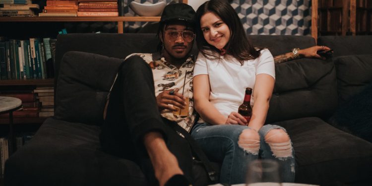 People on couch drinking. Photo by LexScope on Unsplash