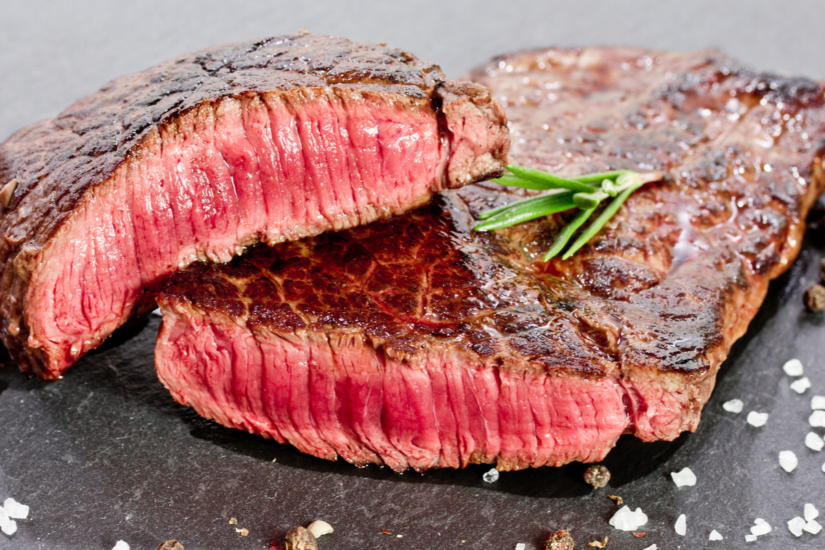 Perfectly cooked steak cut in half