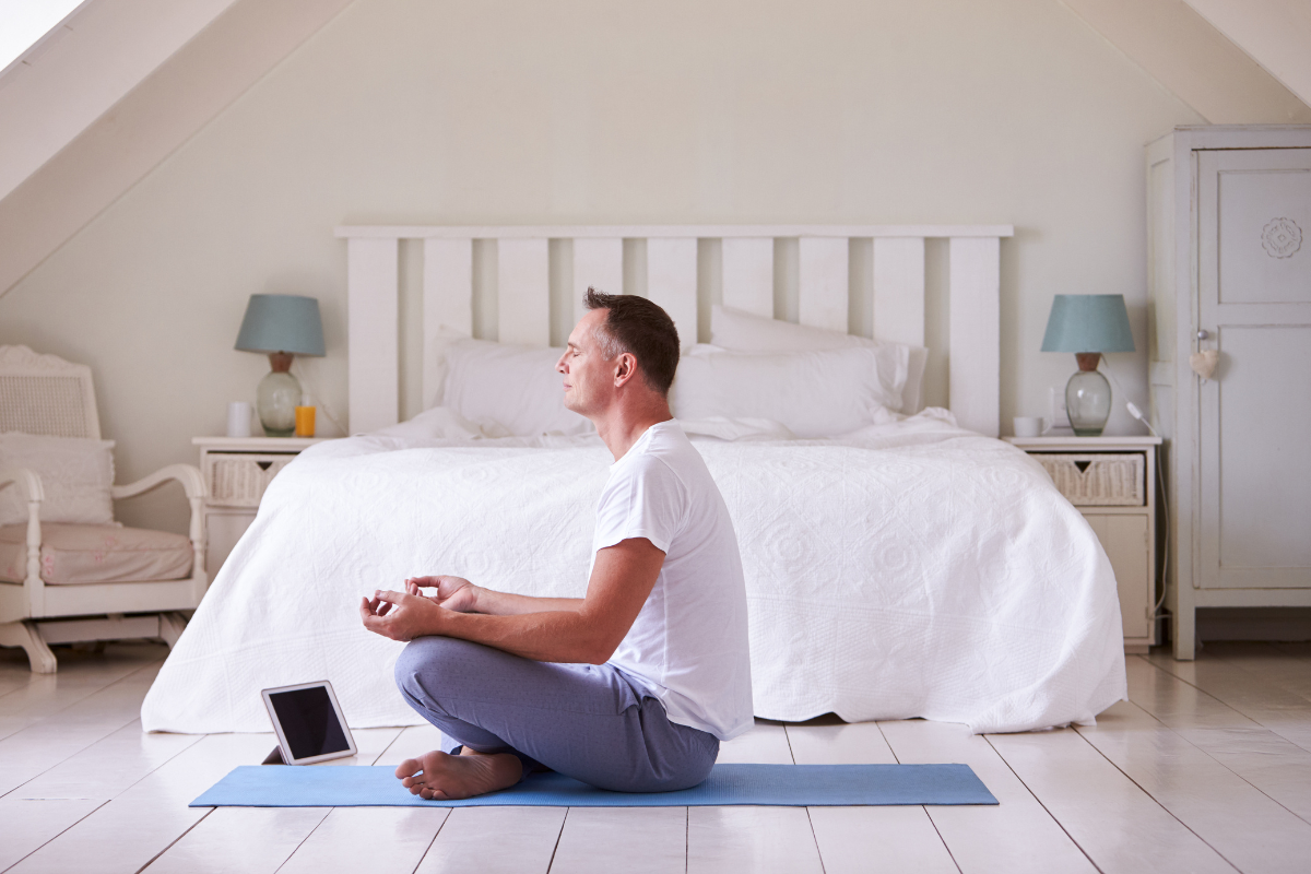Beginners Guide 8 Tips to Start a Yoga Practice At Home. Photographed by Monkey Business Images. Image via Shutterstock.