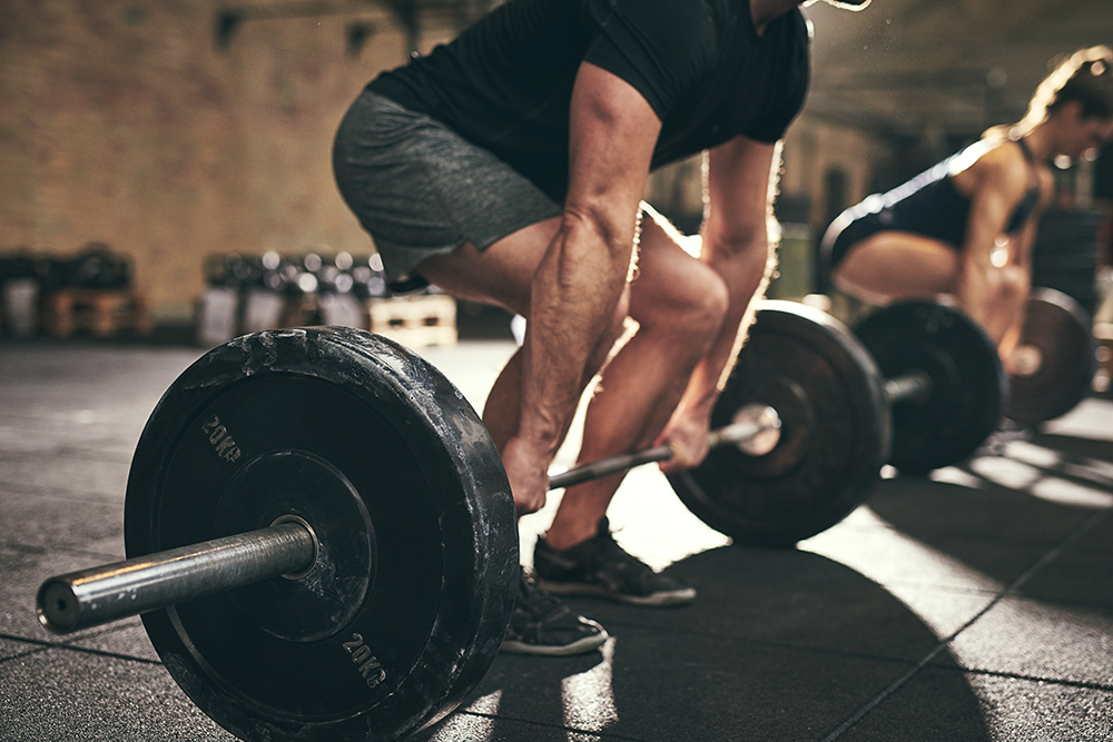 Male athlete executing deadlifts. Image purchased