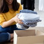 Donating or selling clothes. Photographed by suriya yapin. Image via Shutterstock