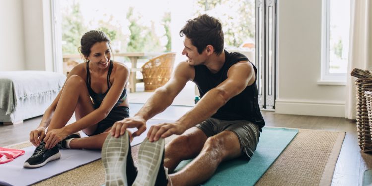 At home exercising. Photographed by Jacob Lund. Image via Shutterstock.
