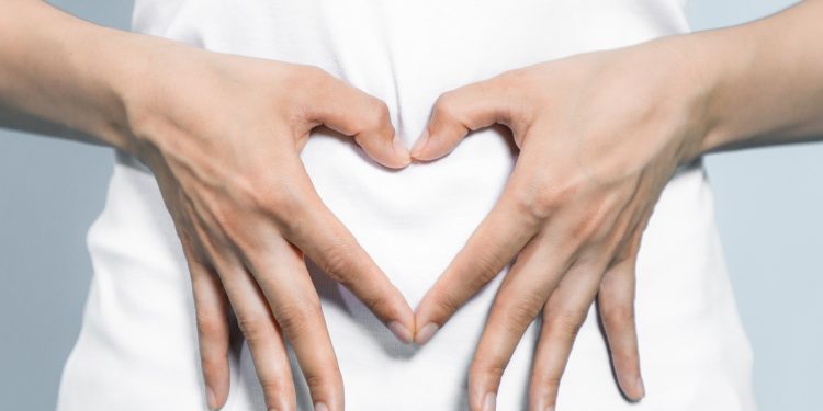 Gut health. Heart on stomach. Photographed by metamorworks. Image via Shutterstock