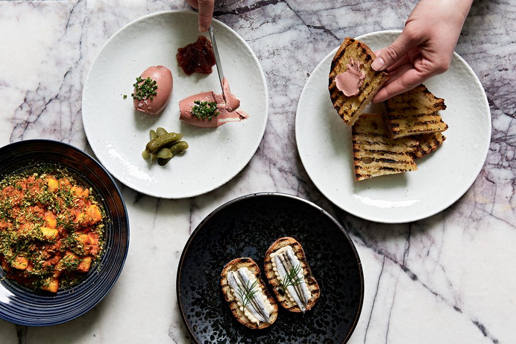Arms Length's white anchovy crostini with white bean puree and fresh dill. Chicken liver pate served with onion jam, and cornichons. Potato gnocchi &amp; pork ragu with pangrattato. Image supplied.