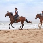 Guests at Bangalay Villas enjoying a beach horse ride experience on Seven Mile Beach, Shoalhaven Heads. Image: Destination NSW