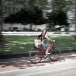A bike ride to work reduces carbon footprint. Photographed by Florian Schmetz. Image via Unsplash
