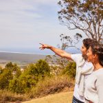 Couple enjoying scenic views across the Shoalhaven region from Coolangatta Estate, Coolangatta. Image: Destination NSW