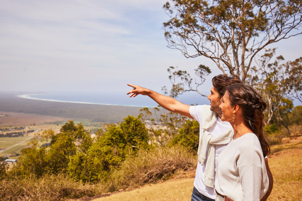 Couple enjoying scenic views across the Shoalhaven region from Coolangatta Estate, Coolangatta. Image: Destination NSW