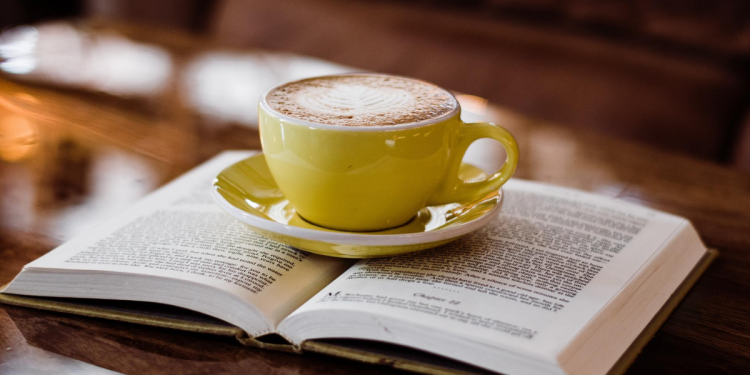 Coffee on Book. Image by Lauren Gray via Unsplash.