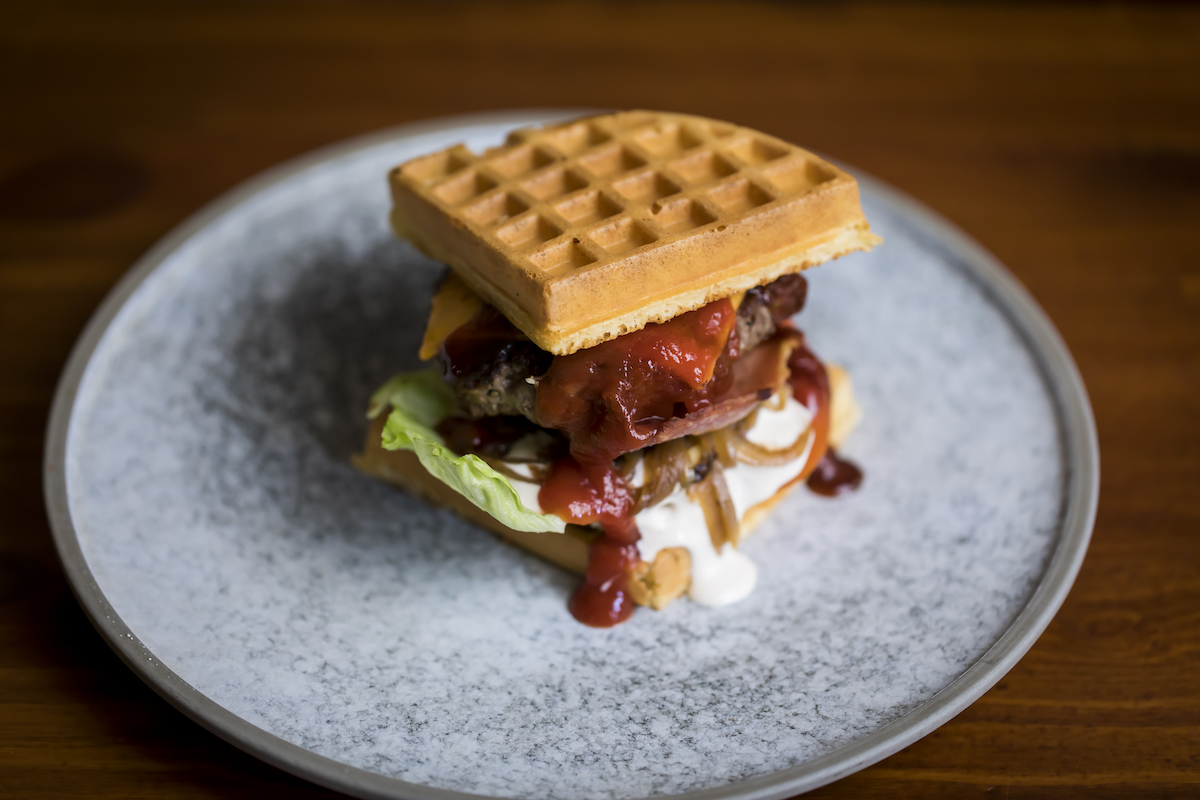 Waffle Burger by Pony Dining The Rocks. Photographed by Anna Kucera. Image supplied