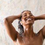 Woman washing hair. Photographed by Rido. Image via Shutterstock