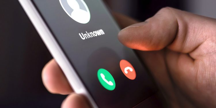 Phone Scam. Image purchased via shutterstock. Image by Tero Vesalainen