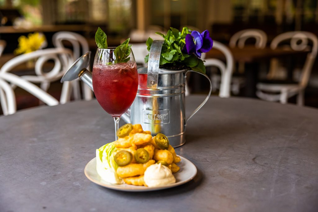 Bramble Spritz ($20) paired with prawn popcorn, jalapeno and iceberg lettuce. Photographed by Hugh O'Brien. Image supplied