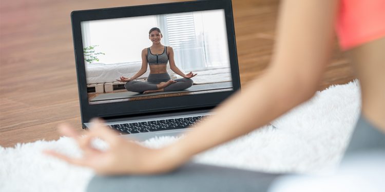 Yoga Class Online. Photographed by Yotlan Jaowattana. Image via Shutterstock.