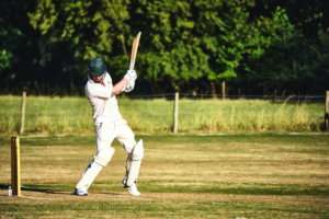 Batsmen in cricket kit. Photographed by Alfred Kenneally. Image via Unsplash.