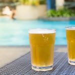 Beer By The Pool. Image Sourced From Shutterstock, Photographed By tostphoto.
