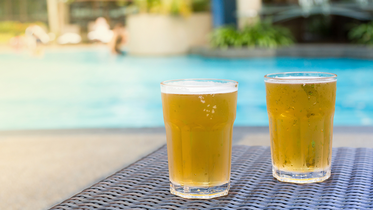 Beer By The Pool. Image Sourced From Shutterstock, Photographed By tostphoto.