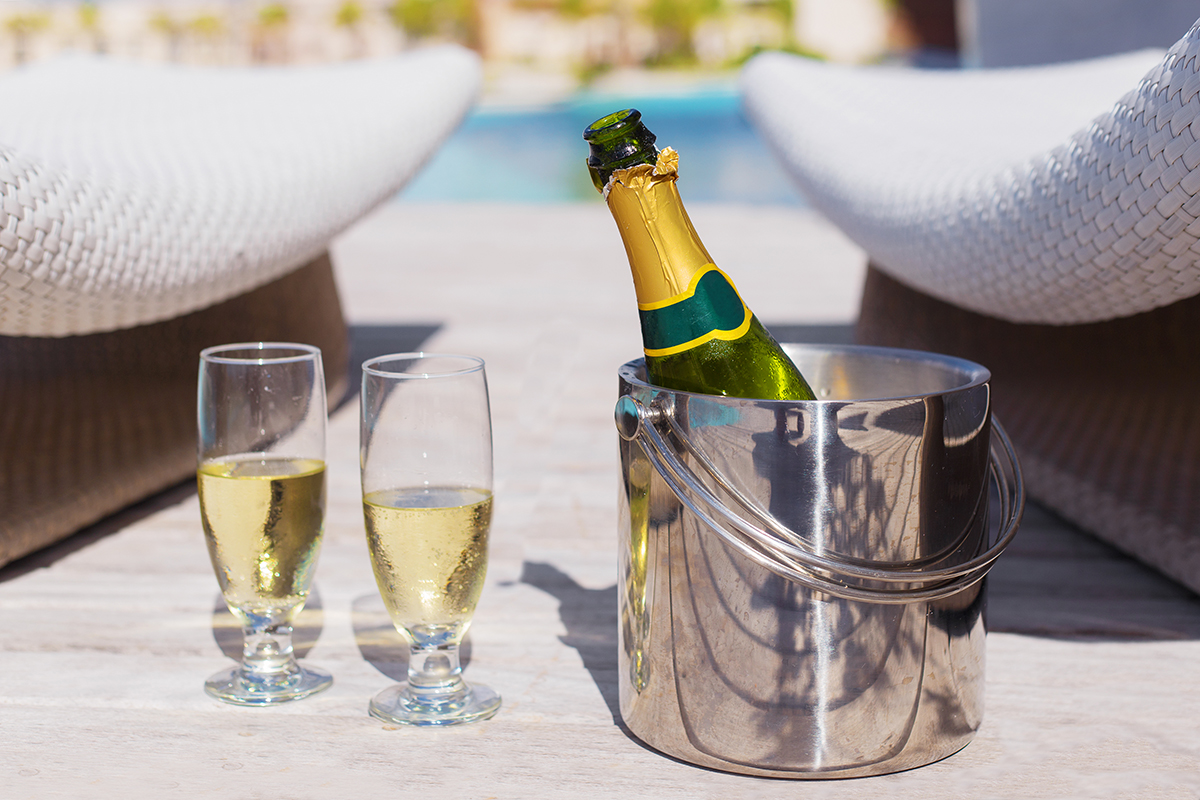 Champagne By The Pool. Image Sourced From Shutterstock, Photographed By Kaspars Grinvalds.